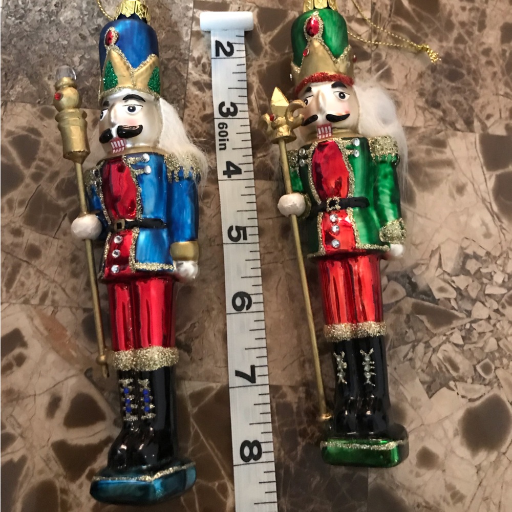 Nutcracker glass ornaments. Approximately 8” long. New.  Blue and green.